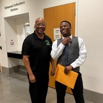 Coach George and Lamar posing together at Operation New Hope