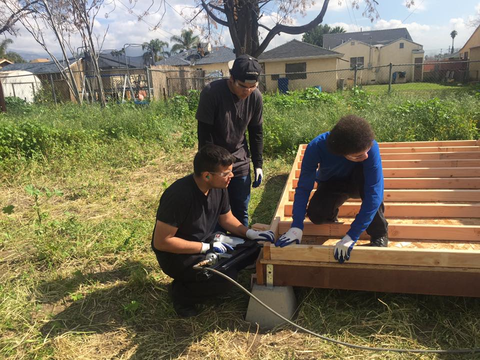 Construction crew building shed