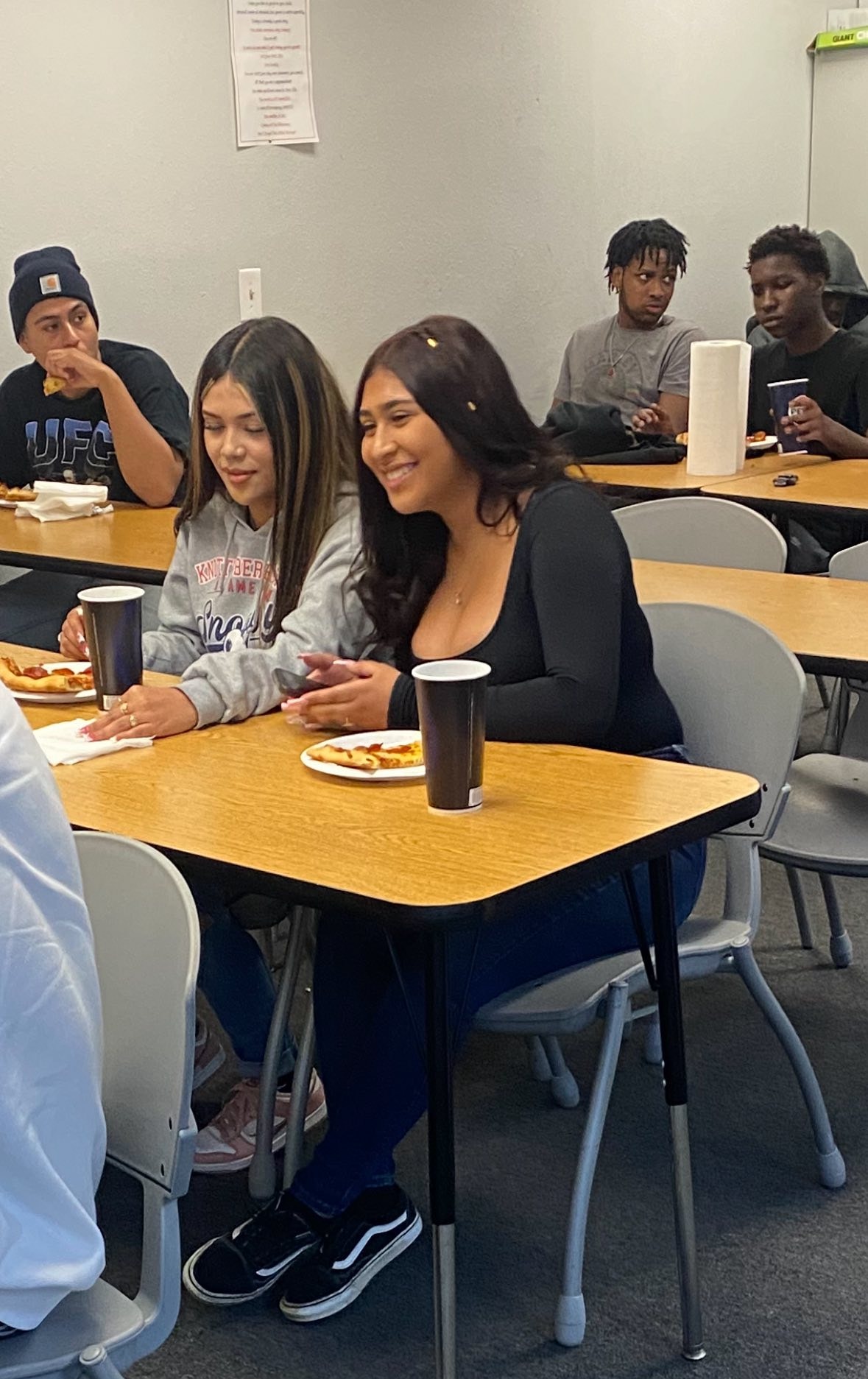 Students breaking bread together