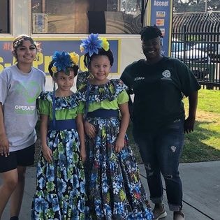 ONH staff with children in folklorico dresses at SB Parks and Rec event