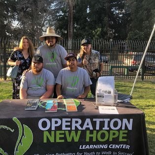 ONH team at Operation New Hope Learning Center booth at community event