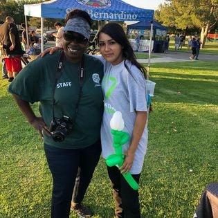Two ONH staff members posing at SB Parks and Rec community event