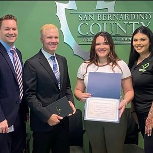 Student receiving certificate at San Bernardino County Workforce Development Board