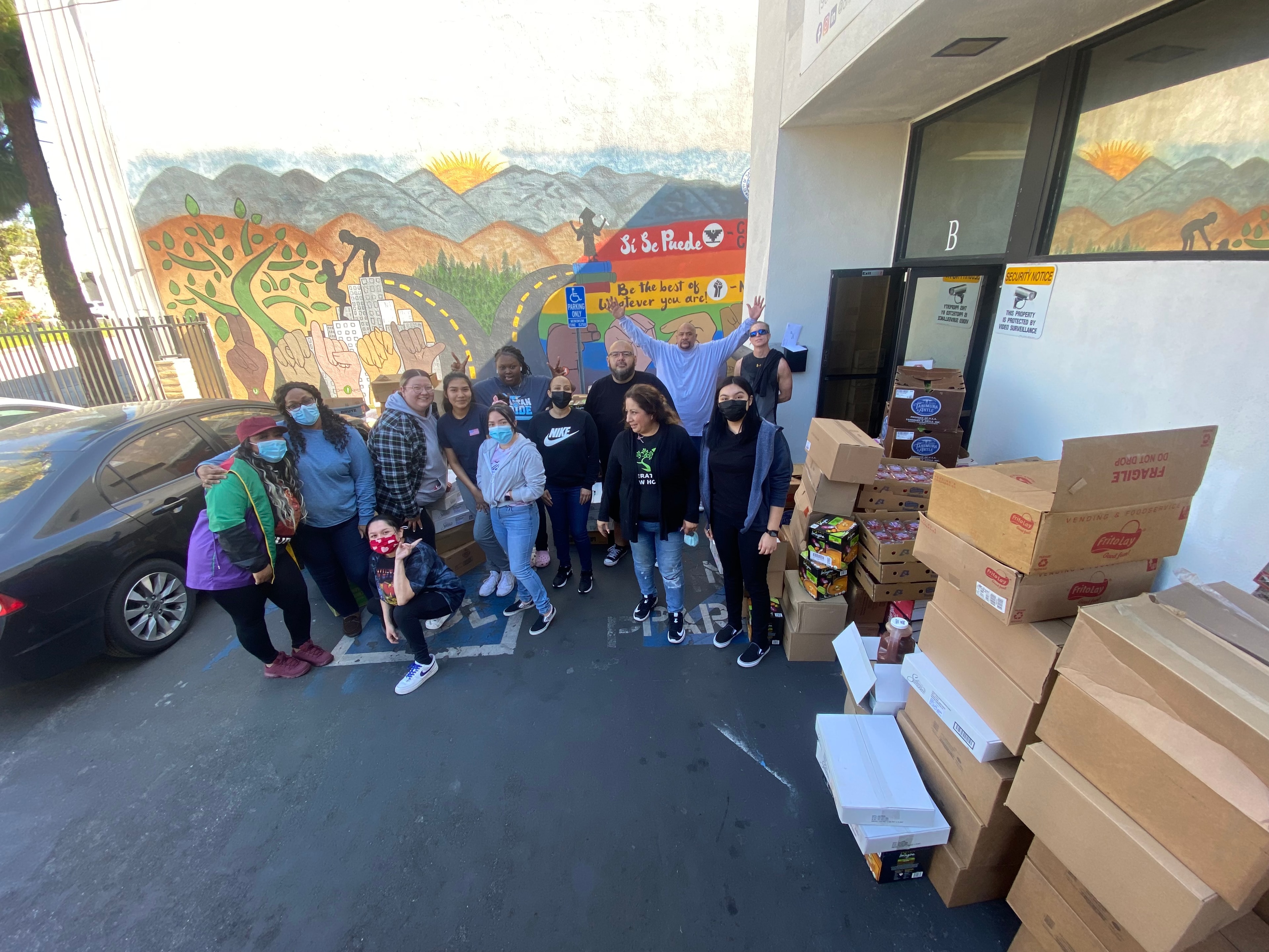 Students giving food — HEAL project community event