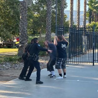 VIP SBPD park day — officers and youth at outdoor court