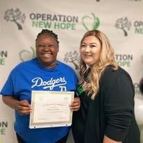 Two people posing with certificate at YRG 2021 graduation Operation New Hope